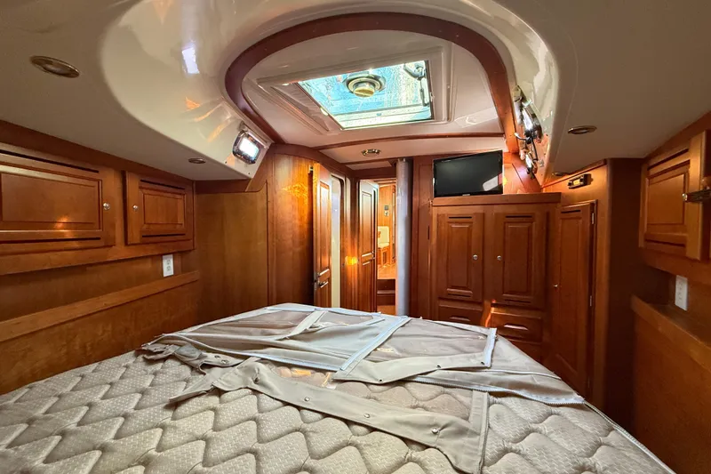 Slide: The Image of Luxurious 2011 Tartan 4700 yacht interior with wood cabinetry and skylight. - 42
