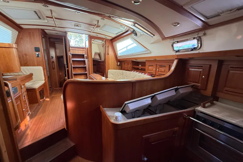 Slide: The Image of Luxurious 2011 Tartan 4700 yacht interior with elegant wood finish and spacious layout. - 51
