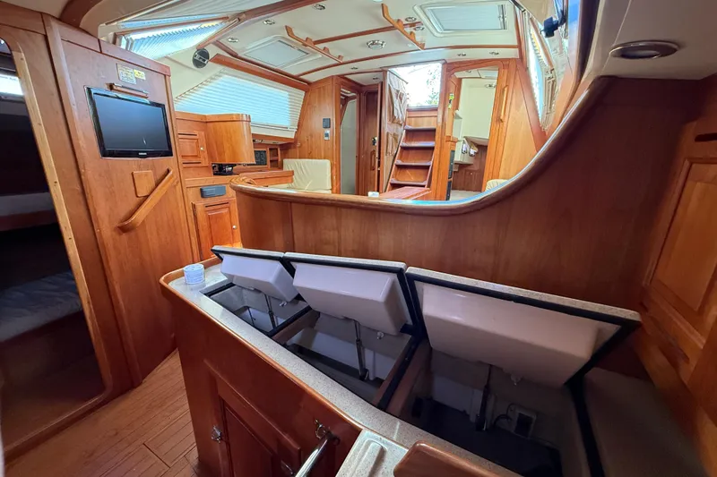 Slide: The Image of Luxurious 2011 Tartan 4700 yacht interior with wood finish and modern amenities. - 52