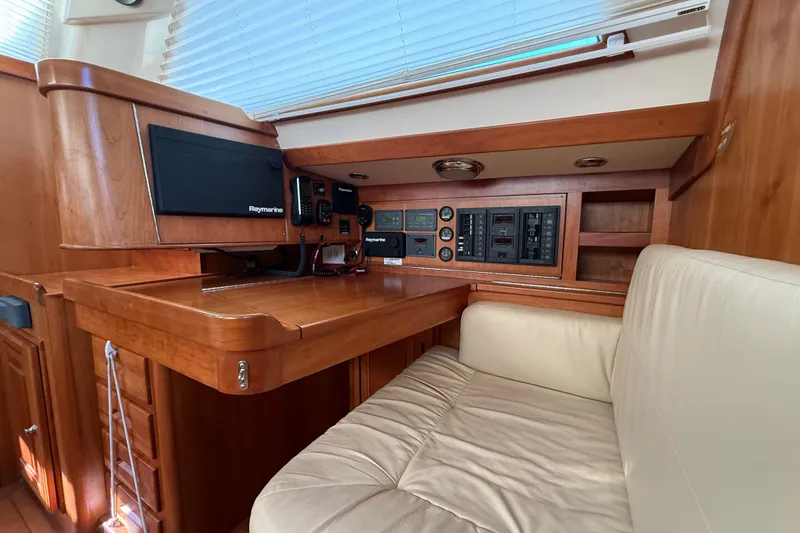 Slide: The Image of Luxurious 2011 Tartan 4700 yacht interior with navigation equipment and comfortable seating. - 57