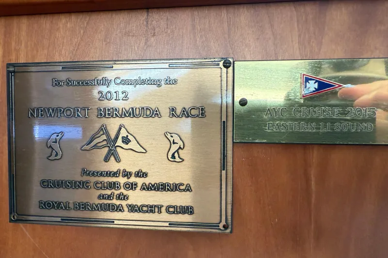 Slide: The Image of Plaques commemorating 2012 Newport Bermuda Race and 2015 AYC Cruise on Tartan 4700 yacht. - 65