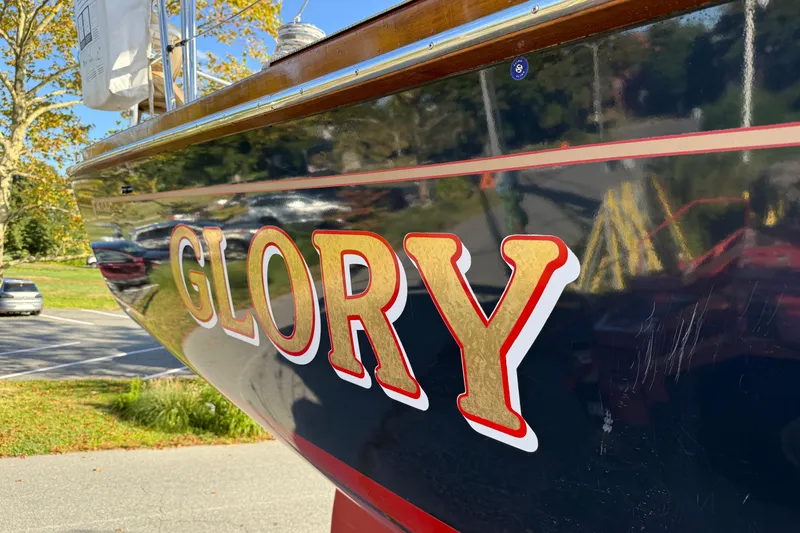 Slide: The Image of Tartan 4700 sailboat from 2011 with "Glory" name on hull. - 9