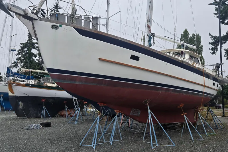 The Image of 1981 Cheoy Lee 43 Pilot House sailboat on stands, ready for maintenance. - 0