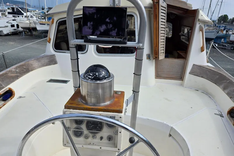 Slide: The Image of 1981 Cheoy Lee 43 Pilot House yacht helm with compass and navigation equipment. - 5