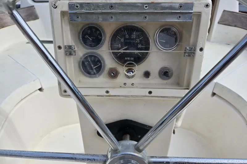 Slide: The Image of 1981 Cheoy Lee 43 Pilot House helm with gauges and steering wheel. - 6