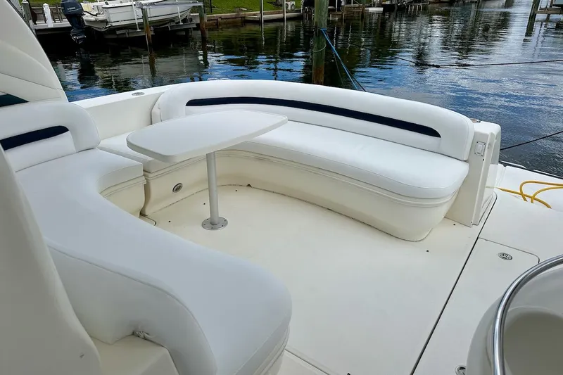 Slide: The Image of Luxurious seating area on a 2004 Sea Ray 420 Sundancer yacht by the water. - 10