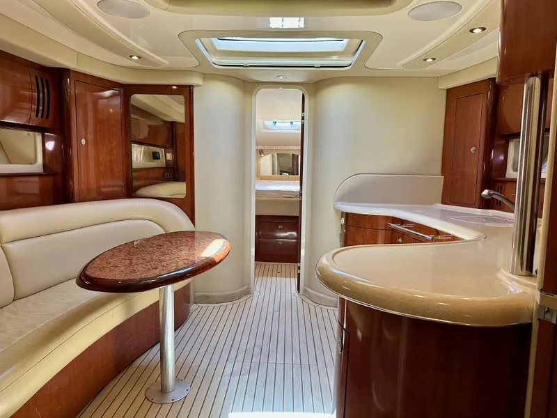 Slide: The Image of Luxurious interior of 2004 Sea Ray 420 Sundancer yacht with elegant wood finishes and modern amenities. - 12