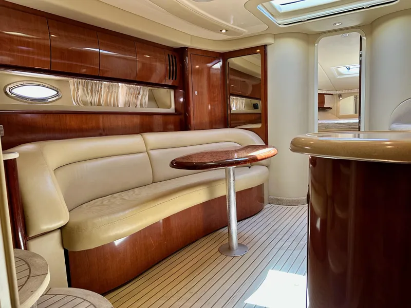 Slide: The Image of Luxurious interior of 2004 Sea Ray 420 Sundancer yacht with elegant wood finishes. - 13