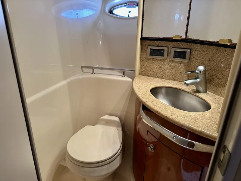 Slide: The Image of Luxurious bathroom in 2004 Sea Ray 420 Sundancer yacht with modern fixtures. - 20