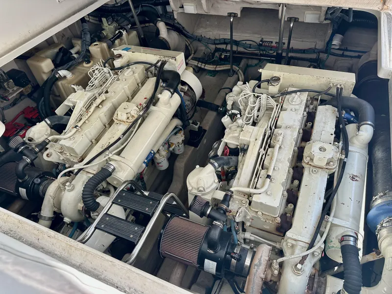Slide: The Image of Engine room of a 2004 Sea Ray 420 Sundancer with dual inboard engines. - 26