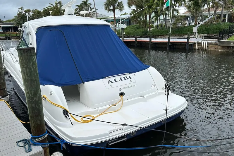 Slide: The Image of 2004 Sea Ray 420 Sundancer docked with blue cover, North Palm Beach. - 34