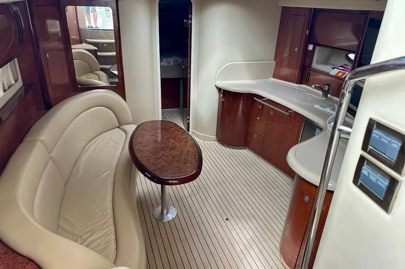Slide: The Image of Luxurious interior of 2004 Sea Ray 420 Sundancer yacht with elegant seating and cabinetry. - 35