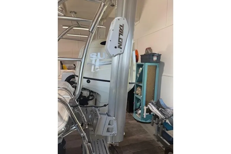 Slide: The Image of 2018 Carolina Skiff 21 Ultra Elite boat with Talon anchor system in garage. - 5