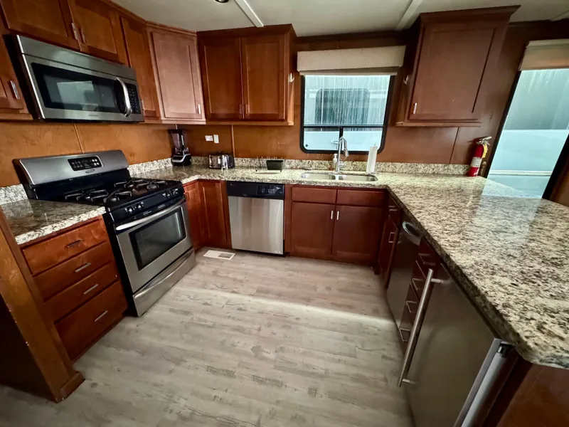 Slide: The Image of Modern kitchen in 2013 Bravada Bella Luna Share #8 with granite countertops and stainless steel appliances. - 8