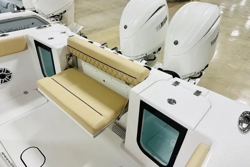 Slide: The Image of 2026 Sportsman Open 262 Center Console with beige seating and dual Yamaha engines. - 11