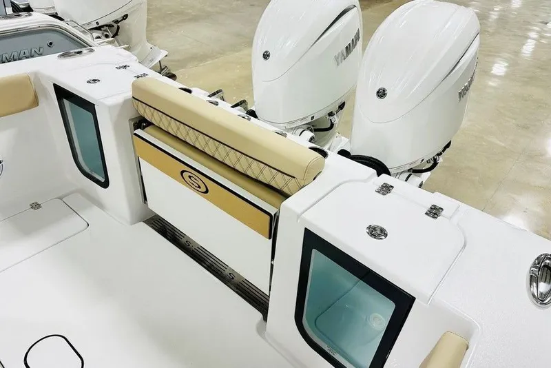 Slide: The Image of 2026 Sportsman Open 262 Center Console boat interior with dual Yamaha engines. - 12