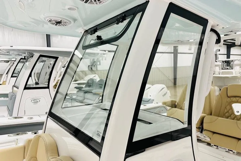 Slide: The Image of 2026 Sportsman Open 262 Center Console boat interior with modern seating and sleek design. - 14