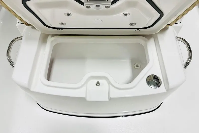 Slide: The Image of Open storage compartment on 2026 Sportsman Open 262 Center Console boat. - 15