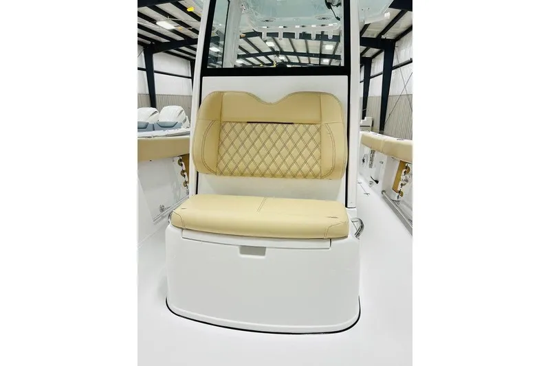 Slide: The Image of 2026 Sportsman Open 262 Center Console boat seat with beige diamond-pattern upholstery. - 16