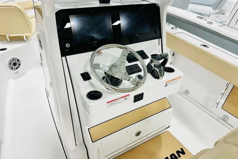 Slide: The Image of 2026 Sportsman Open 262 Center Console boat dashboard with steering wheel and controls. - 5