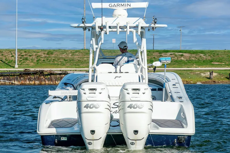 Slide: The Image of 2021 Yellowfin 32 Offshore boat with dual 400 Verado engines on the water. - 2