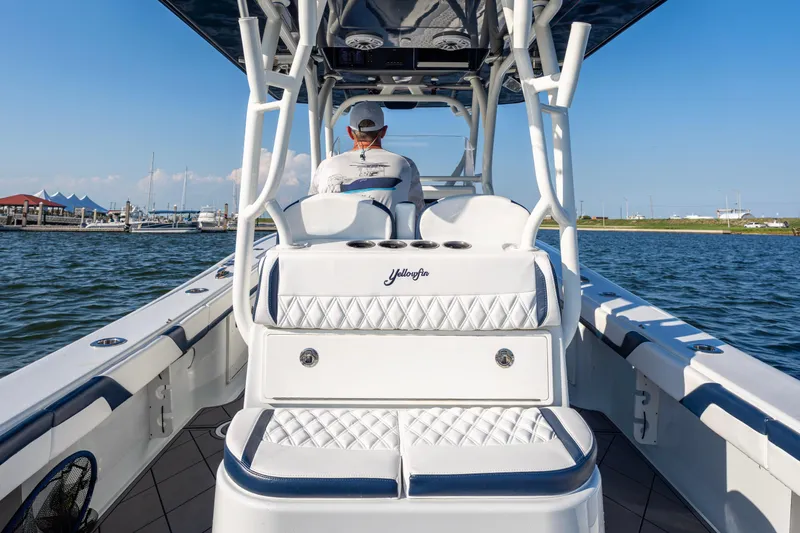 Slide: The Image of 2021 Yellowfin 32 Offshore boat on water, featuring luxurious seating and sleek design. - 7
