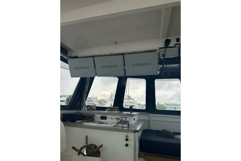 Slide: The Image of Interior of 1987 Monroe Custom 52 boat with Garmin navigation displays. - 10