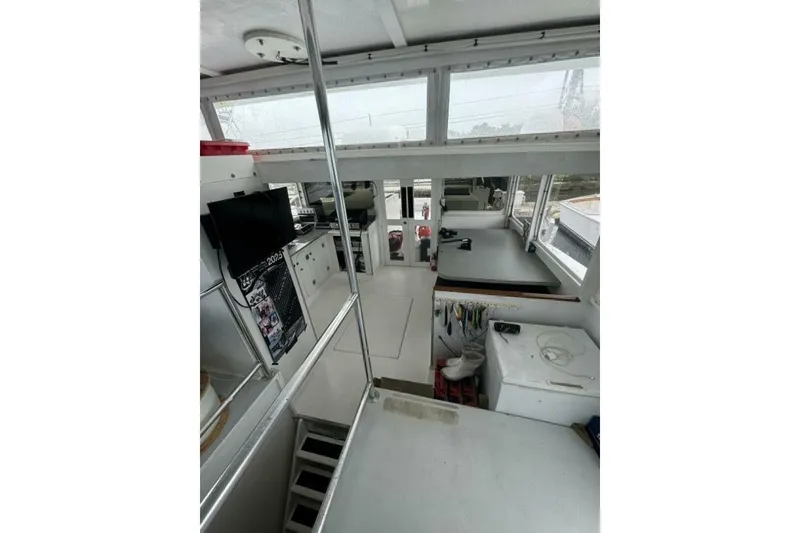 Slide: The Image of Interior of 1987 Monroe Custom 52 boat with modern equipment and spacious layout. - 13