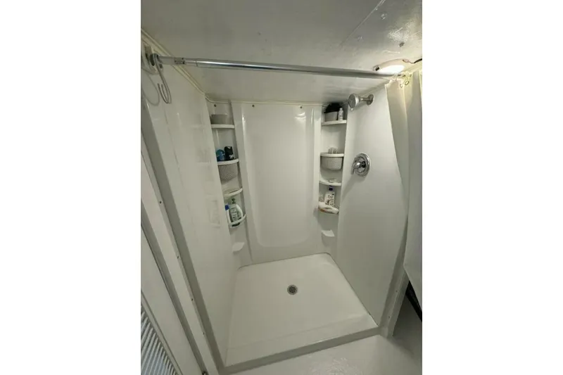 Slide: The Image of Compact shower area with shelves in a 1987 Monroe Custom 52. - 24