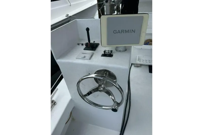 Slide: The Image of Boat steering console with Garmin display, Monroe Custom 52, 1987 model. - 42