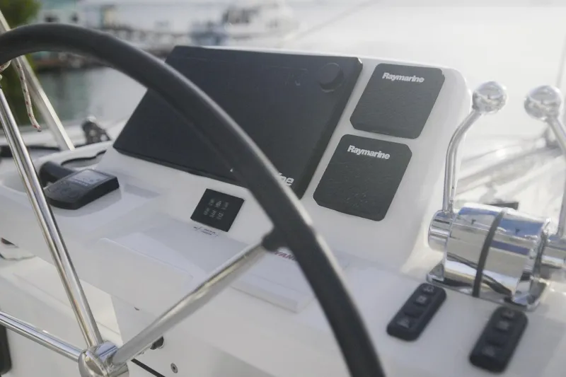 Slide: The Image of 2024 Lagoon 51 yacht helm with Raymarine navigation equipment. - 14