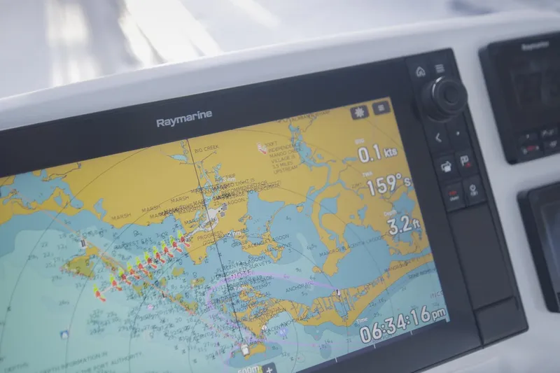 Slide: The Image of Raymarine navigation display on 2024 Lagoon 51 yacht, showing nautical chart and data. - 15