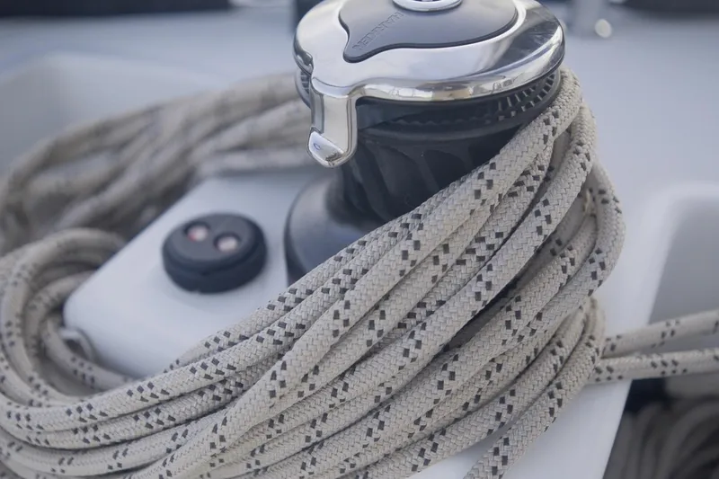Slide: The Image of Close-up of winch and rope on 2024 Lagoon 51 sailboat. - 16