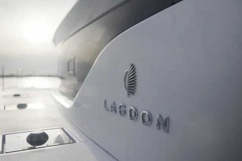 Slide: The Image of 2024 Lagoon 51 yacht logo with sleek design in sunlight. - 17