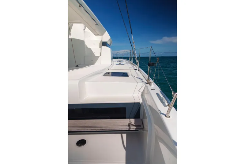 Slide: The Image of 2024 Lagoon 51 yacht deck with sleek design and ocean view. - 19