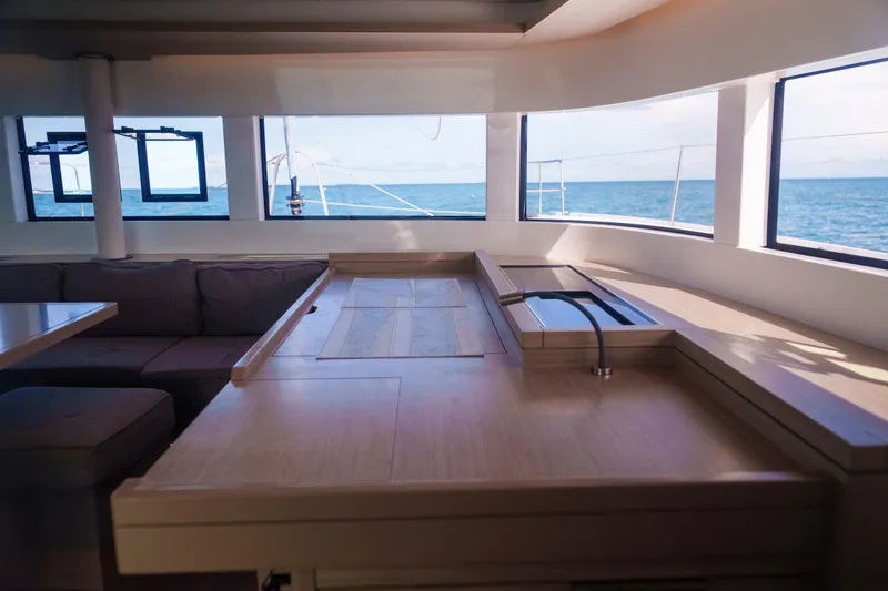 Slide: The Image of Interior of 2024 Lagoon 51 yacht with ocean view through large windows. - 32