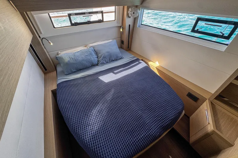 Slide: The Image of Luxurious cabin interior of 2024 Lagoon 51 yacht with ocean view windows. - 37