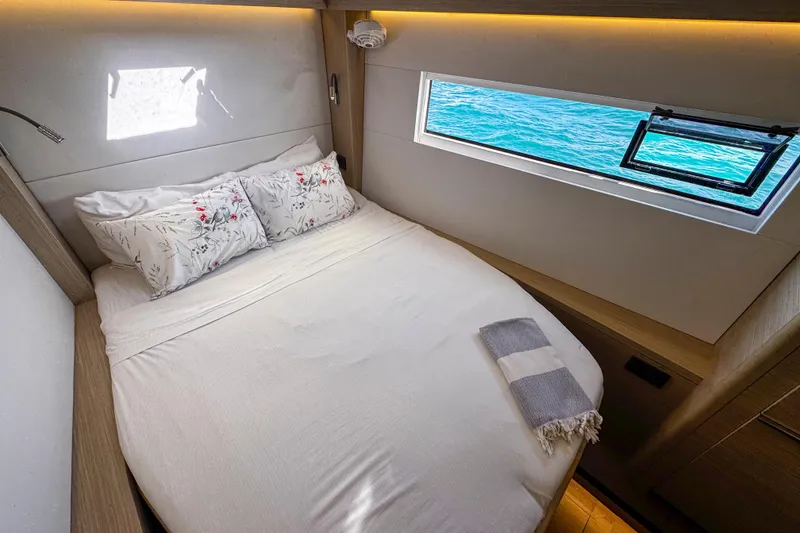 Slide: The Image of Luxurious cabin interior of 2024 Lagoon 51 yacht with ocean view window. - 39