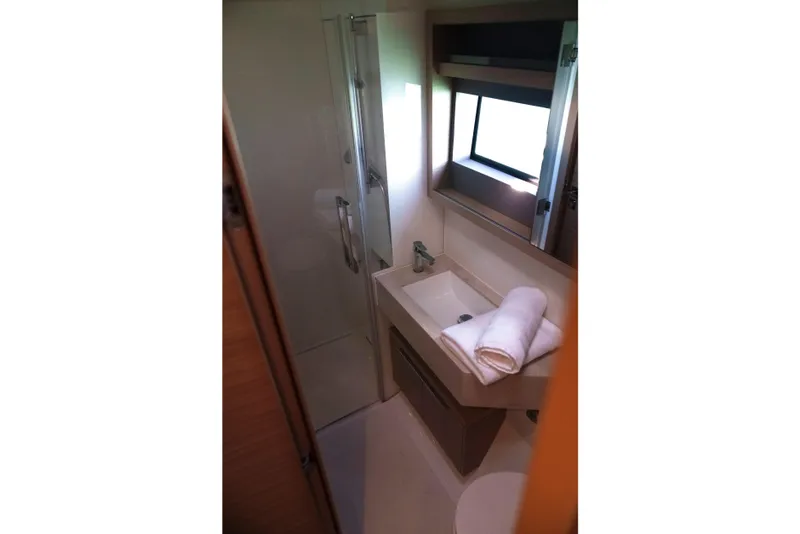 Slide: The Image of Bathroom interior of 2024 Lagoon 51 yacht with modern sink and shower. - 44