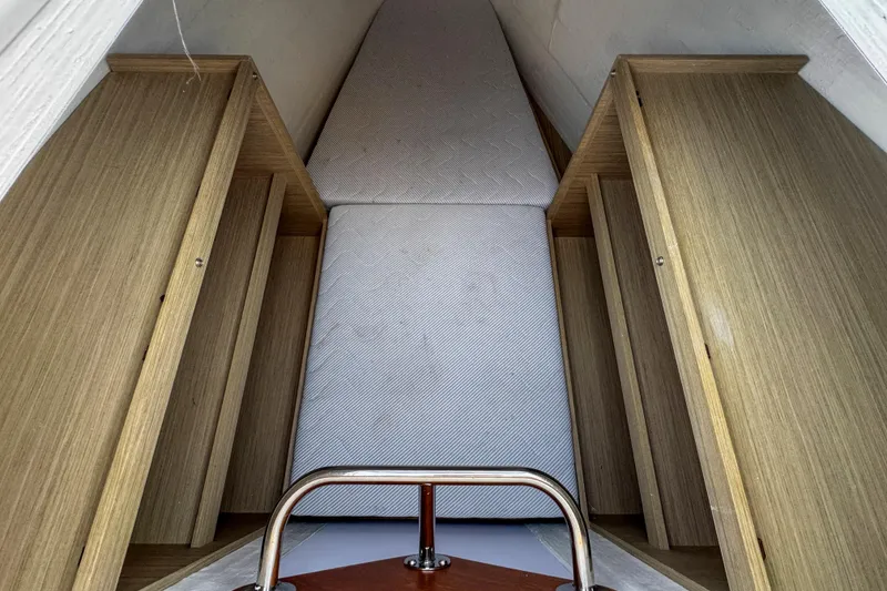 Slide: The Image of Interior cabin of 2024 Lagoon 51 yacht with wooden storage and mattress. - 48