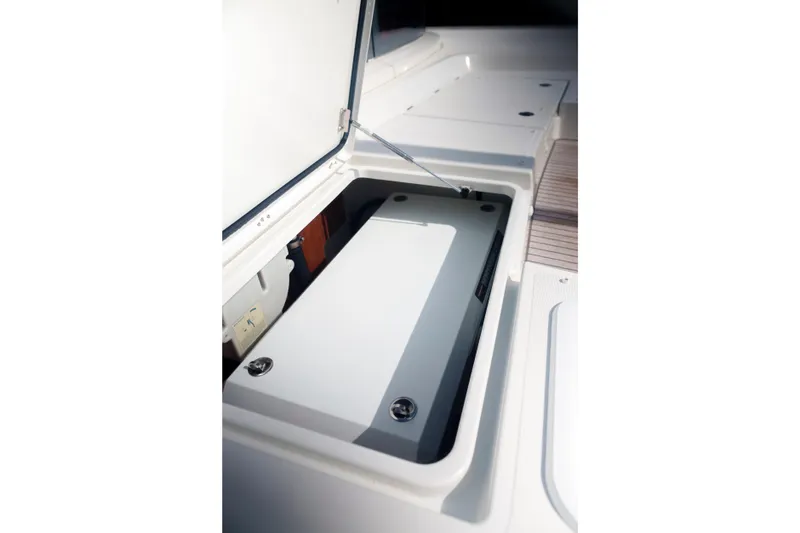 Slide: The Image of Open storage compartment on 2024 Lagoon 51 yacht deck. - 53