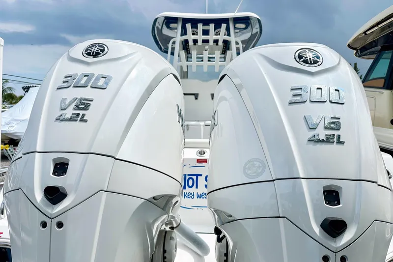 Slide: The Image of 2024 Tidewater 292 CC Adventure with dual Yamaha 300 V6 4.2L outboard engines. - 4