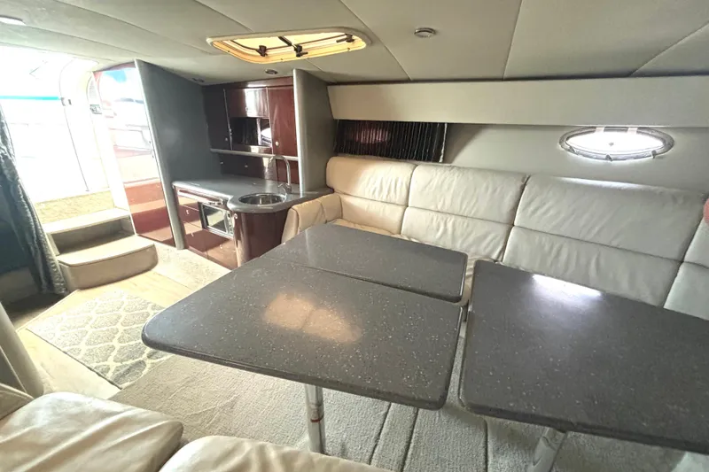 Slide: The Image of Interior of 2006 Formula 400 Super Sport Crossover yacht with kitchenette and seating area. - 43
