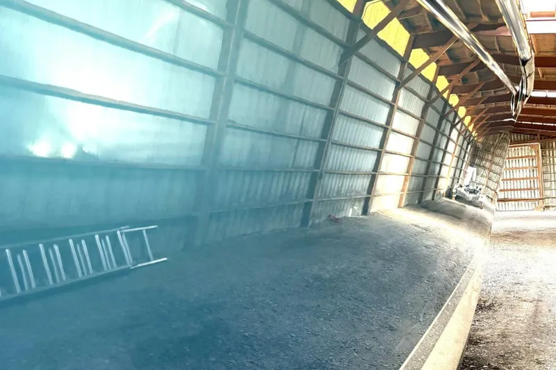 Slide: The Image of Reflection on Formula 400 Super Sport Crossover boat hull in a storage facility. - 13