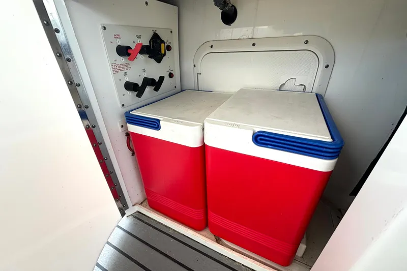 Slide: The Image of Red coolers and control panel inside 2006 Formula 400 Super Sport Crossover boat. - 23