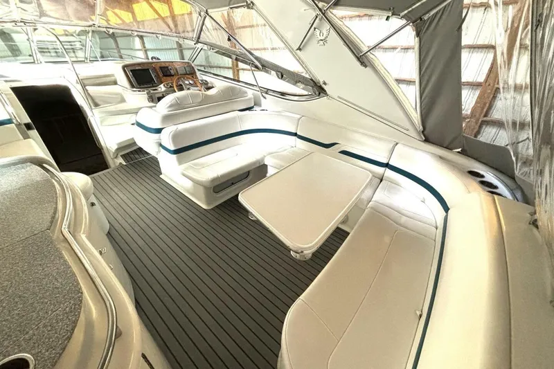 Slide: The Image of Luxurious interior of 2006 Formula 400 Super Sport Crossover boat with seating and helm. - 17