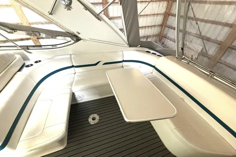 Slide: The Image of Interior of 2006 Formula 400 Super Sport Crossover boat with seating and table. - 18