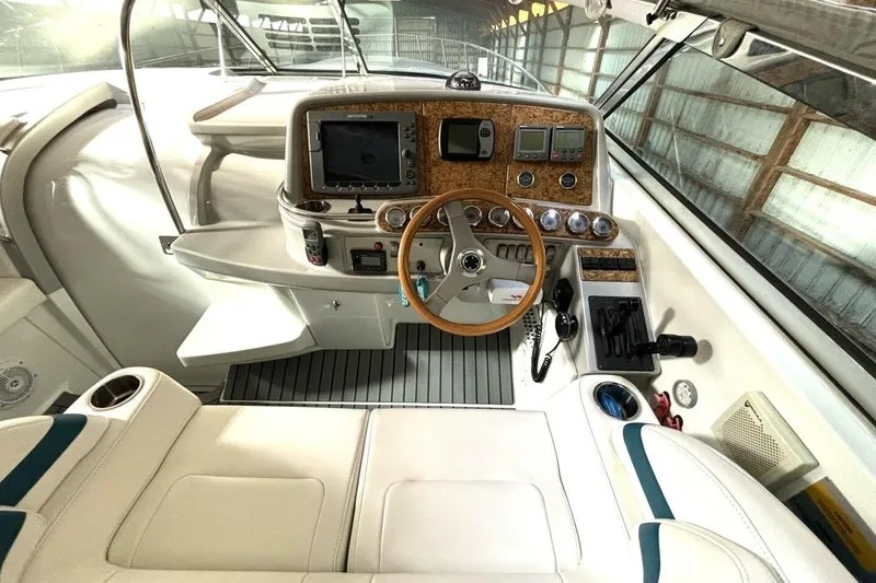 Slide: The Image of Cockpit of 2006 Formula 400 Super Sport Crossover with steering wheel and navigation controls. - 25