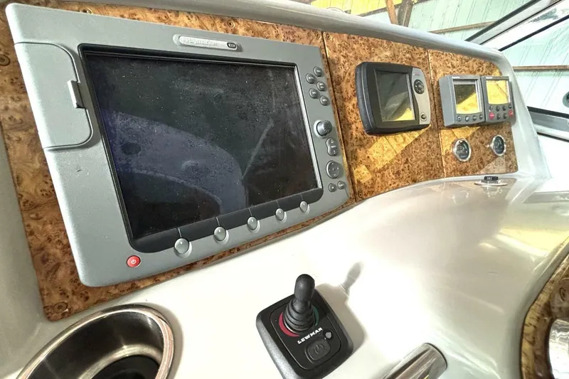 Slide: The Image of Control panel of a 2006 Formula 400 Super Sport Crossover boat with navigation screens. - 27
