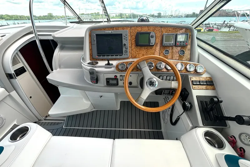 Slide: The Image of Cockpit of 2006 Formula 400 Super Sport Crossover with wood accents and modern controls. - 27